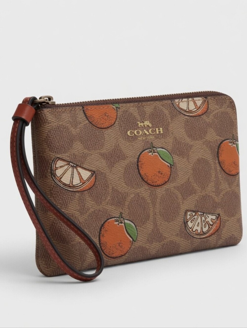 COACH Brown Signature Orange Print Wristlet Pouch